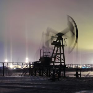 oil-and-gas-industry-panoramic-of-pumpjack-on-oilfield-and-oil-refinery-on-the-winter-sky-background-with-light-pillar-effect-night-view-petroleum-concept (1)